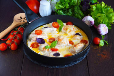 Chicken fillet in cream in a frying pan