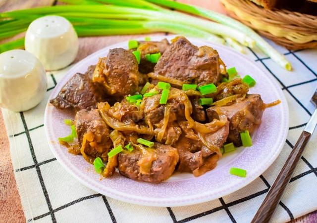 Pork liver fried in a frying pan with onions juicy and soft