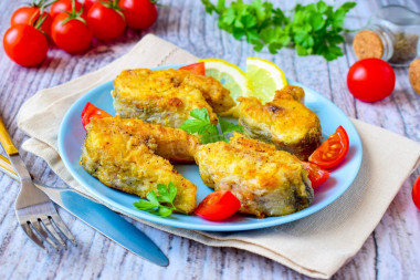 Pollock fried in flour in a frying pan