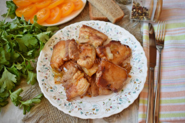 Fried bacon in a frying pan