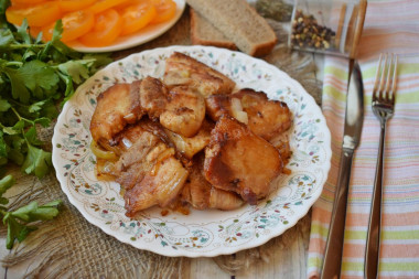 Fried bacon in a frying pan