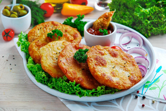 Onion tortillas in a frying pan