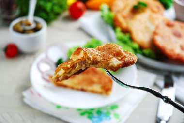 Onion tortillas in a frying pan