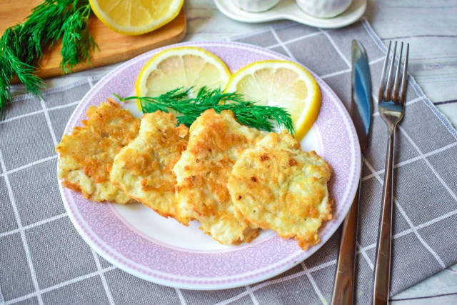 Pollock fried in egg and flour in a frying pan