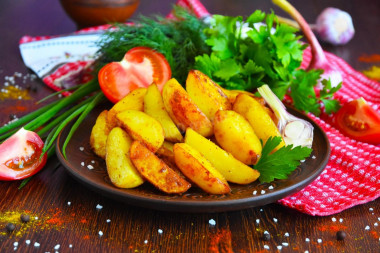 Rustic fried potatoes in a frying pan