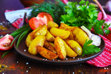 Rustic fried potatoes in a frying pan