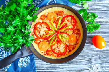 Pizza in a frying pan without sour cream and kefir in 10 minutes