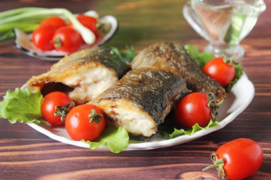 Fried herring in a frying pan