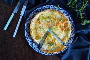 Pita bread pie with cheese in a frying pan