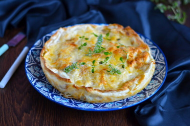 Pita bread pie with cheese in a frying pan