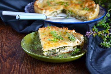 Pita bread pie with cheese in a frying pan