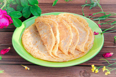 Thin custard pancakes with milk and boiling water