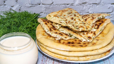 Kefir tortillas stuffed with cheese and cottage cheese with herbs