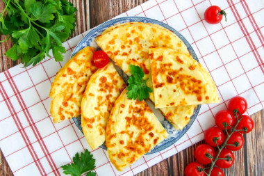 Quick khachapuri with cheese in a pan