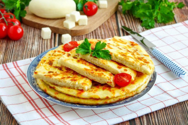 Quick khachapuri with cheese in a pan