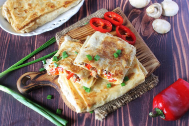 Pita bread with filling fried in a pan