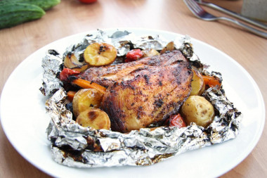 Chicken on coals in foil