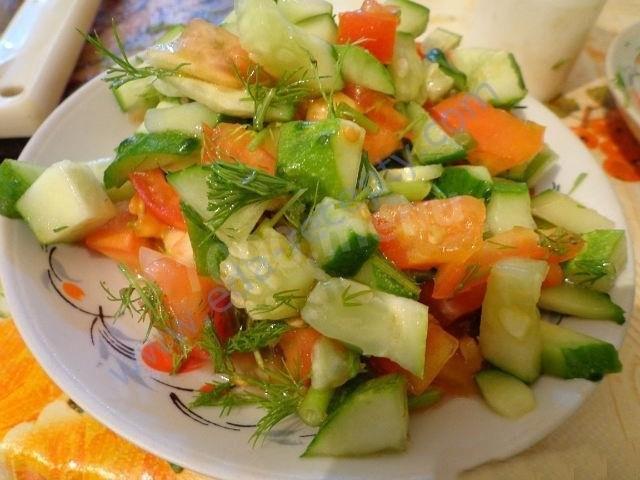 Light summer tomato salad cucumbers greens