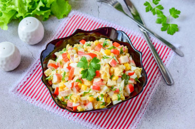 Salad with orange and crab sticks