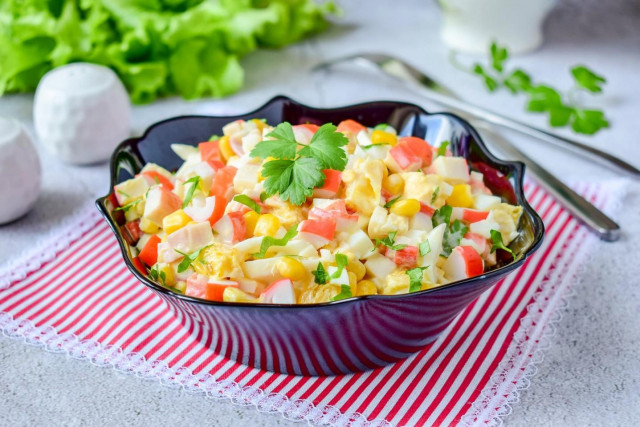 Salad with orange and crab sticks