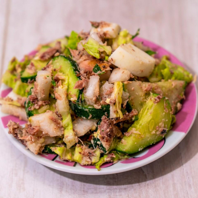 Summer salad with fresh cucumbers and canned tuna