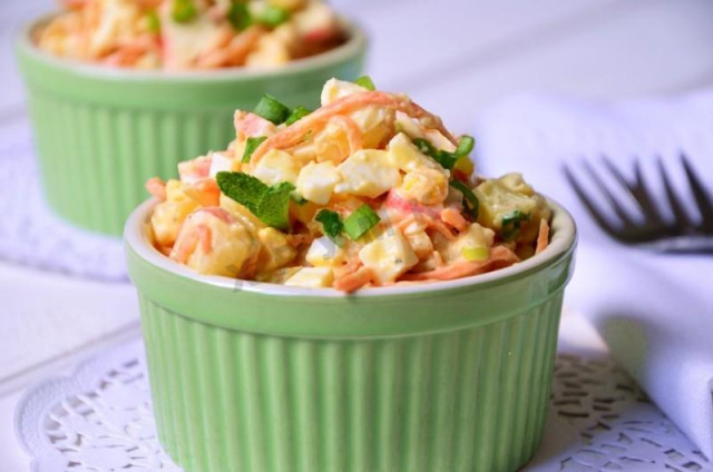 Salad with carrots, potatoes, corn and crab sticks