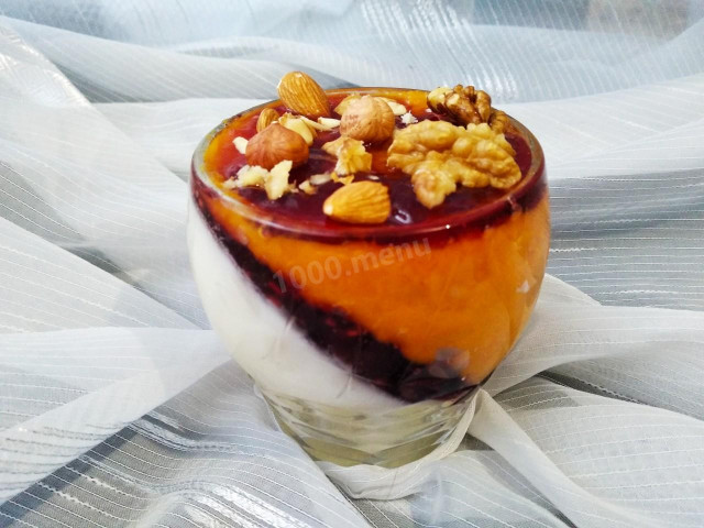 Creamy pumpkin dessert with nuts, jam and cinnamon