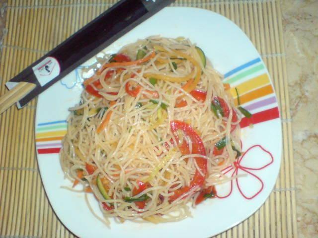 Vegetarian funchosa salad with various vegetables