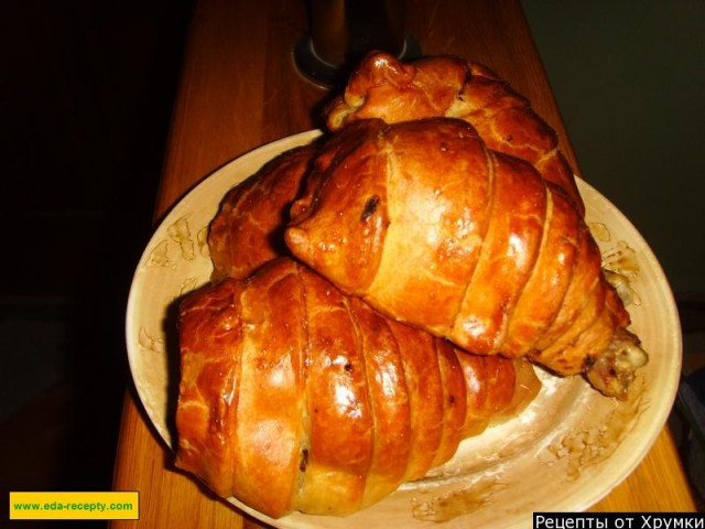 Chicken legs with cheese in a puff pastry bag