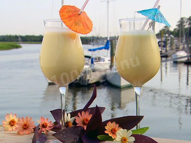 Pina colada cocktail with cherry fruit decoration