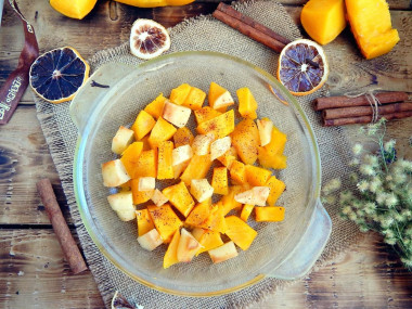 Baked pumpkin in the microwave with slices of honey