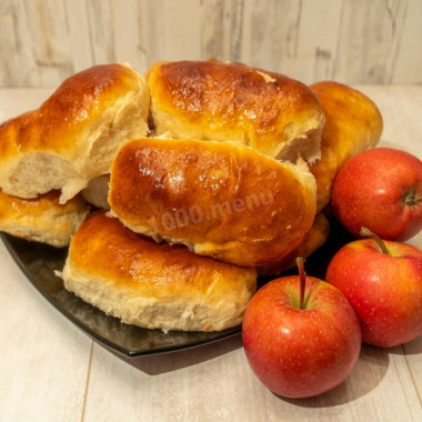 Pastry pies with apple filling in the oven