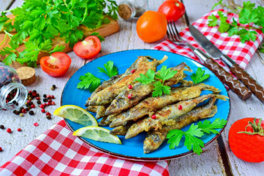 Capelin fried in a frying pan