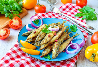 Capelin fried in a frying pan