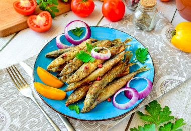 Capelin fried in a frying pan