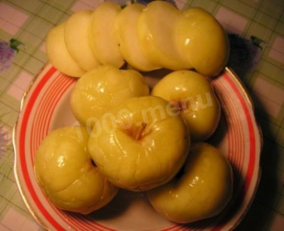 Soaked apples with currant and cherry leaves