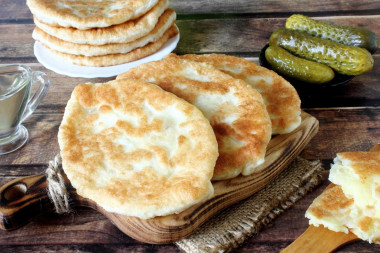 Fried pies on pan with milk