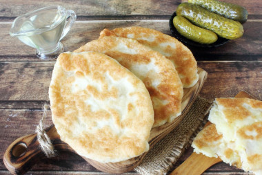 Fried pies on pan with milk