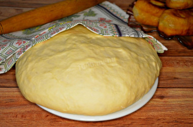 Dough for pies in a frying pan on water