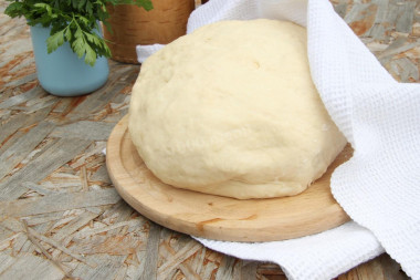 Dough for fried pies in a frying pan