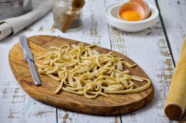 Homemade noodles for soup on eggs