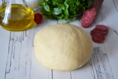 Pizza dough on boiling water