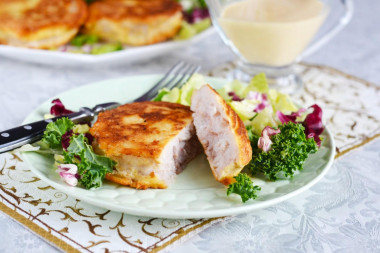 Hake medallions in a frying pan