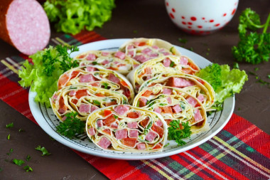 Pita bread roll with sausage and cheese