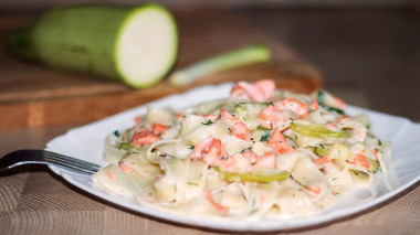 Pasta with red fish in cream sauce