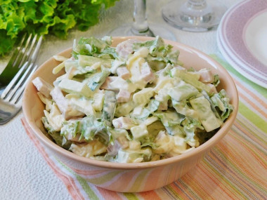 Tender salad with cheese and ham with apple