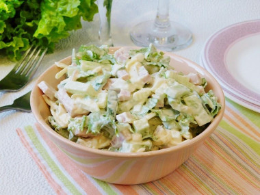 Tender salad with cheese and ham with apple