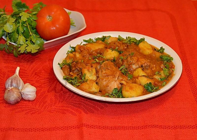 Chicken Chakhokhbili with potatoes in a frying pan