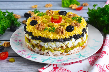 Salad with prunes and chicken layers