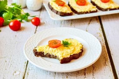 Sandwiches with black bread and cheese